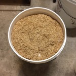 Fermenter bucket full of malt